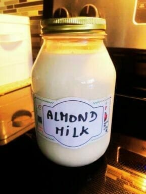 Almond milk in a glass container